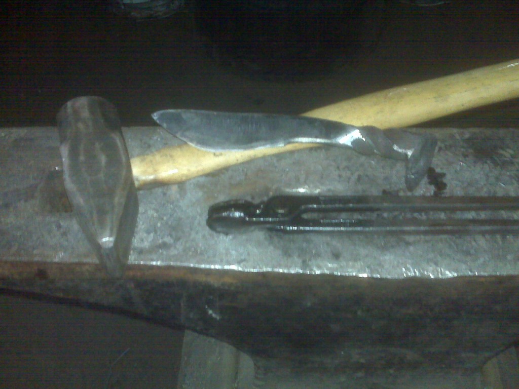 Anvil, hammer, tongs and a knife