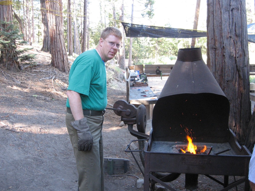 Turning the blower handle for the forge