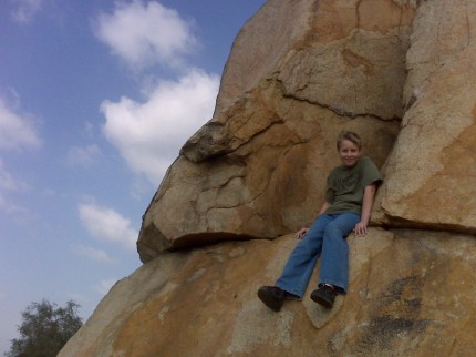 Jacob climbing rocks on Mt. Rubidoux while geocaching